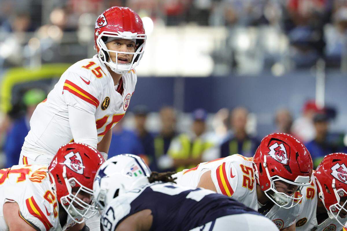 Kansas City Chiefs quarterback Patrick Mahomes gets ready for the snap during an NFL Week 13 Thanksgiving Day game against the Dallas Cowboys at AT&T Stadium in Arlington, Texas on Thursday, Nov. 27, 2025.