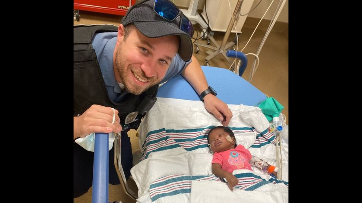 Kansas City Police Officer Richard DuChaine and his partner, Officer Charles Owen, responded to a medical call regarding a 1-month-old girl who wasn’t breathing. DuChaine, who later posed in the hospital with the infant, was able to get the girl breathing again.