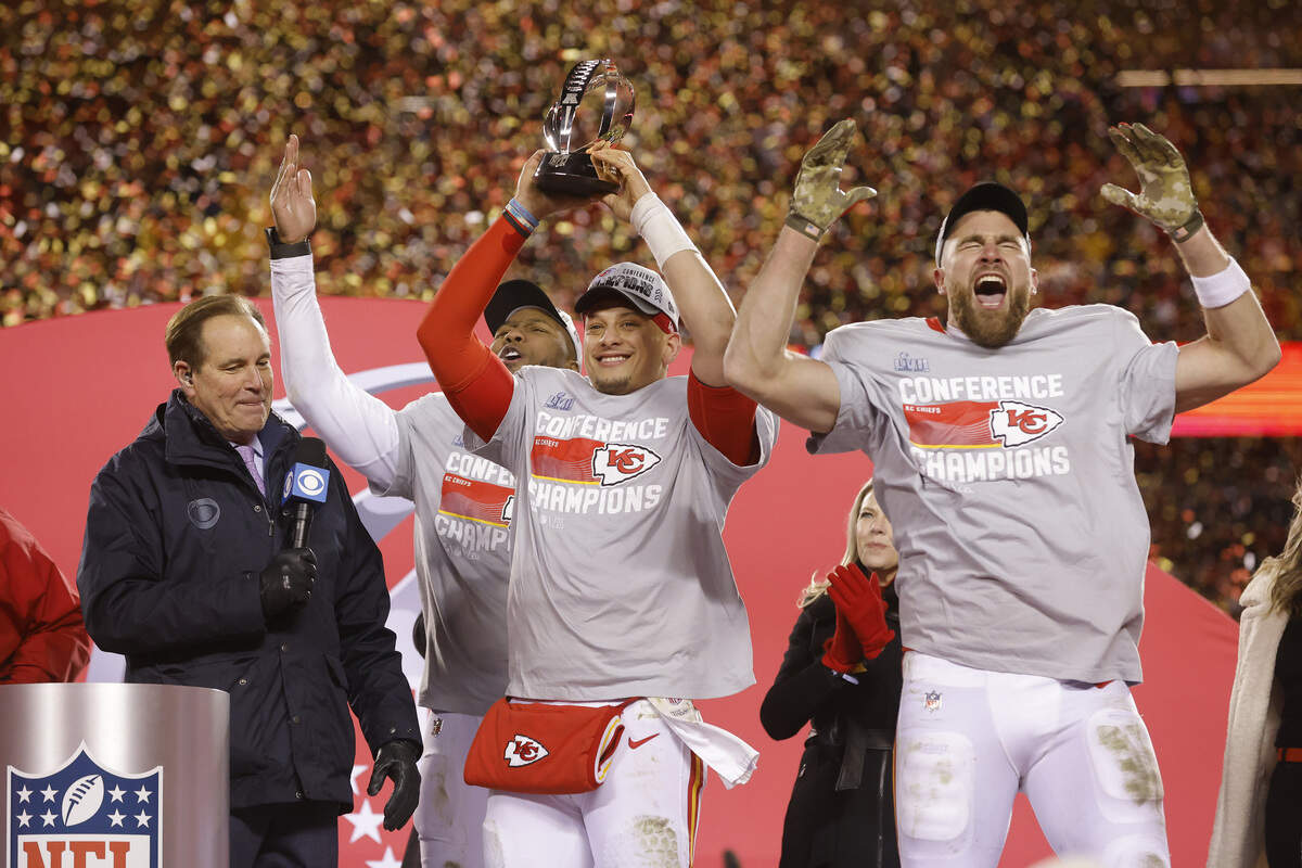 Patrick Mahomes #15 and Travis Kelce #87 of the Kansas City Chiefs celebrate after defeating the Cincinnati Bengals 23-20 in the AFC Championship Game at GEHA Field at Arrowhead Stadium on January 29, 2023 in Kansas City, Missouri.