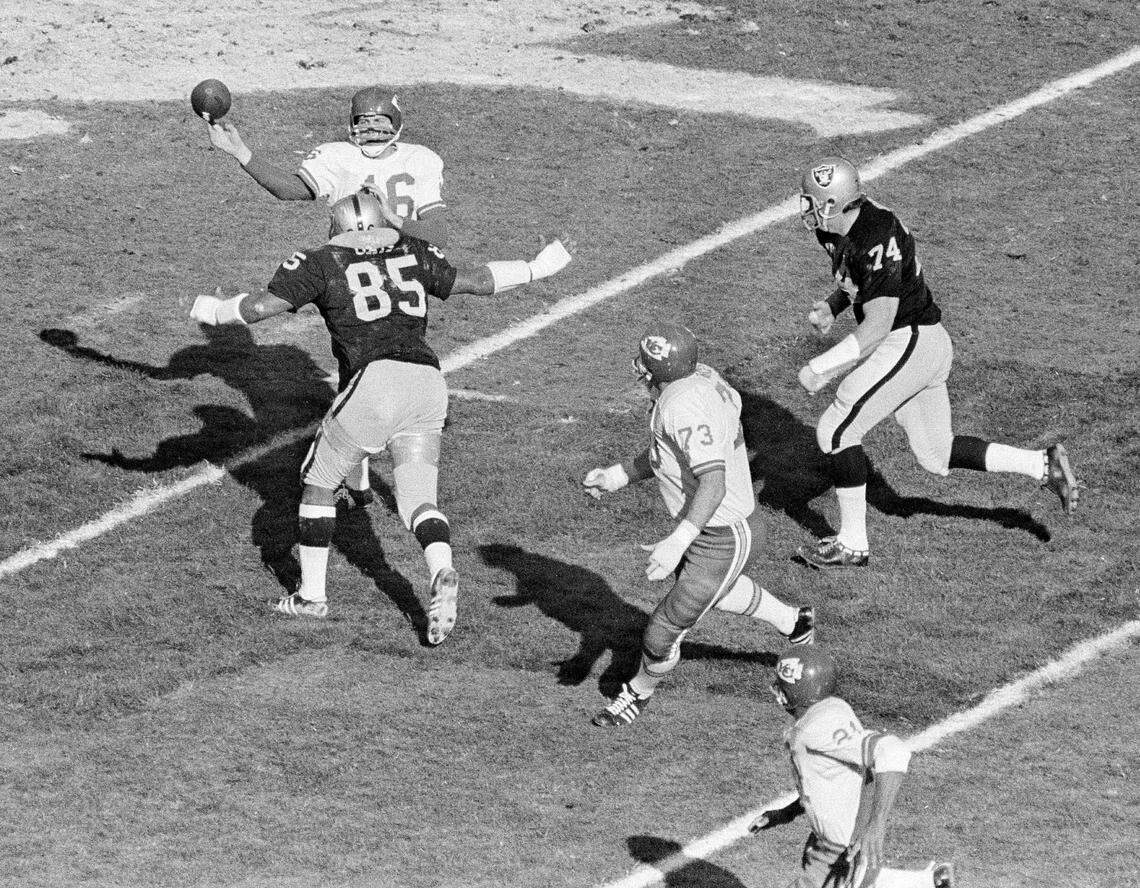 With defensive tackle Carleton Oats (85) bearing down on him, quarterback Len Dawson of the Kansas City Chiefs (16) lets go a pass in the second half of the AFL championship game in Oakland, Calif., Jan. 4, 1970. The Chiefs won the AFL title by downing the Raiders, 17-7.