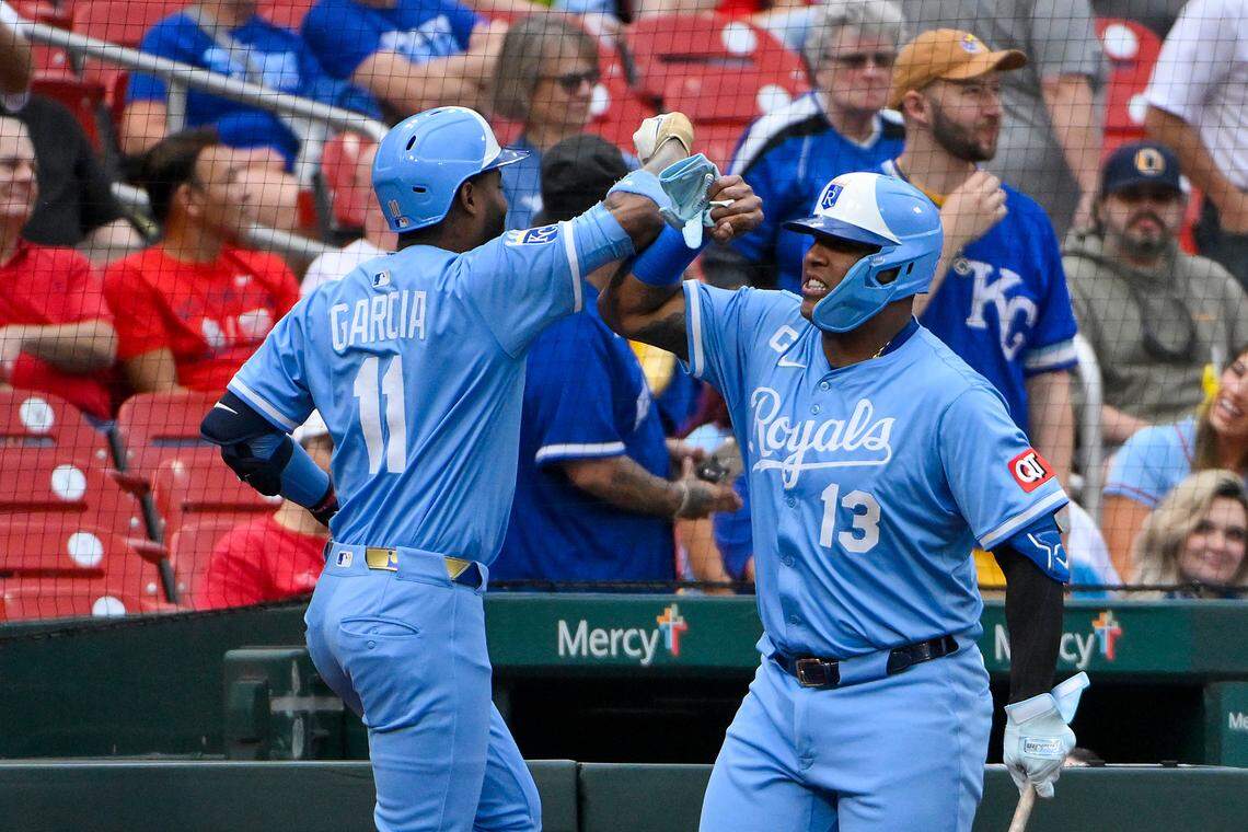 Kansas City Royals center fielder Maikel Garcia (11) is congratulated by first baseman Salvador Perez (13) after hitting a two run home run against the St. Louis Cardinals during the first inning at Busch Stadium on Jun 5, 2025 in St. Louis, Missouri, USA.