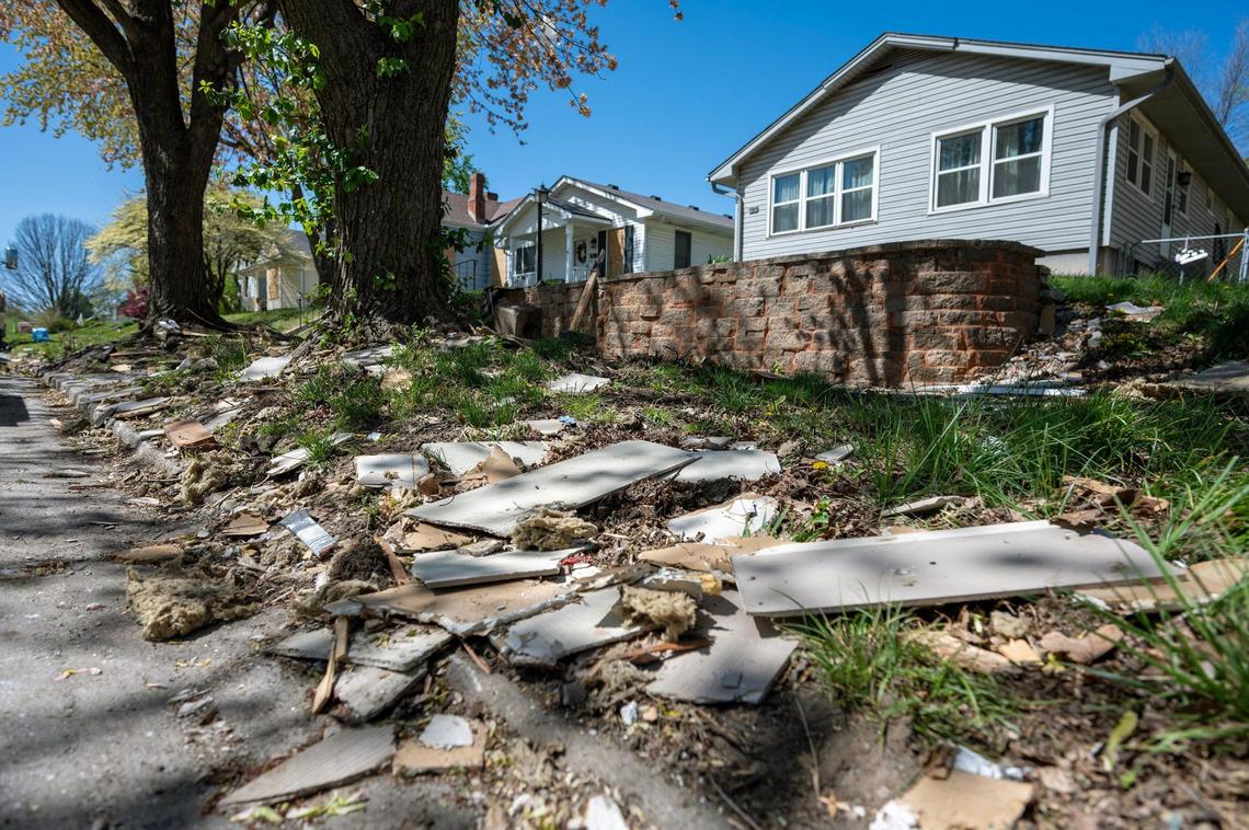 Debris and building materials remain scattered along the sidewalk on Franklin Avenue on Tuesday, April 15, 2025, in Lexington, Missouri, after a gas explosion shattered windows and damaged nearby structures.
