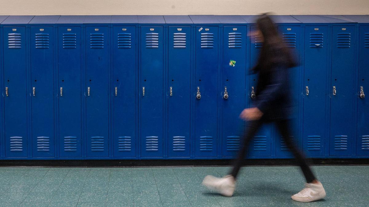 A student walks past lockers in one of the hallways at Central Middle School on Tuesday, April 16, 2024, in Kansas City, Kansas.