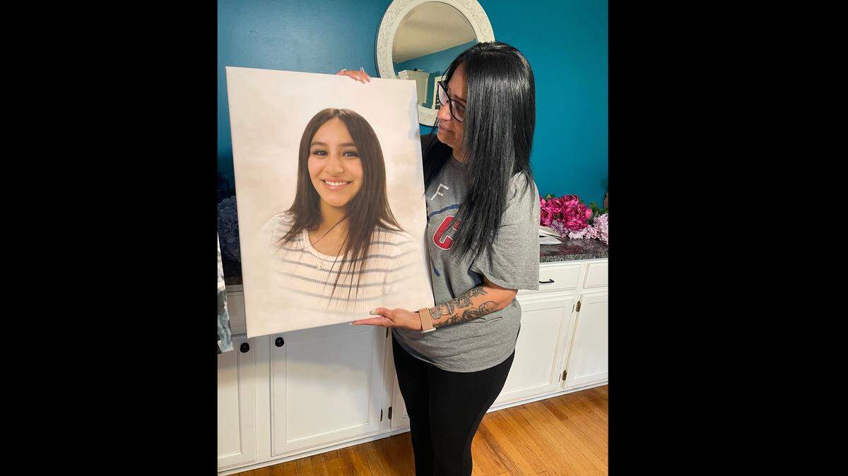 Alicia Herrera-Aquino holds a picture of her 21-year-old daughter, Yasmene Herrera, whose death on March 15, 2026 police are investigating as a murder-suicide. Herrera leaves behind a weeks-old baby boy.