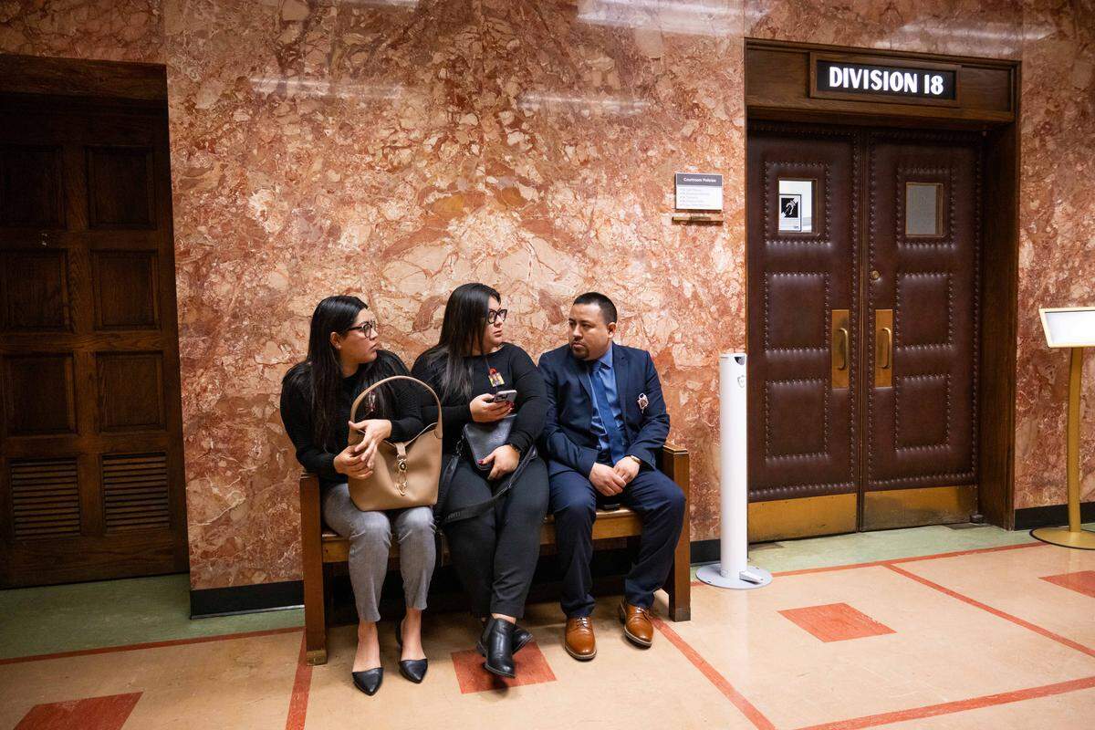 Family members of Lisa Lopez-Galvan, sit outside the courtroom prior to the plea hearing for Dominic Miller, at Jackson County Courthouse, on Monday, March 9, 2026, in Kansas City. Miller is accused of fatally shooting Lopez-Galvan during the 2024 Chiefs Super Bowl rally mass shooting.