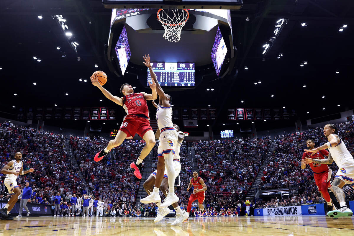 Dylan Darling #0 of the St. John's Red Storm shoots the ball against Elmarko Jackson #13 of the Kansas Jayhawks during the second half at Viejas Arena on March 22, 2026 in San Diego.