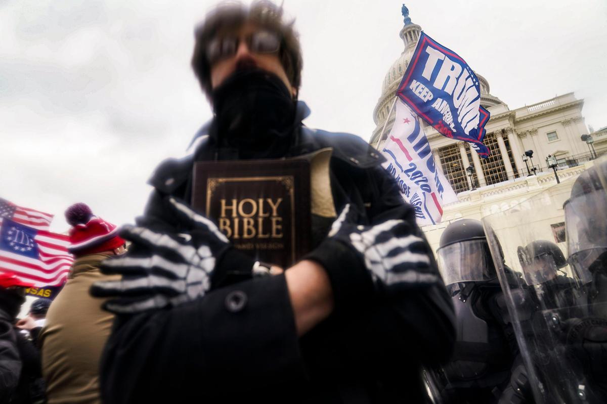 Trump supporters gather outside the Capitol, Wednesday, Jan. 6, 2021, in Washington. As Congress prepares to affirm President-elect Joe Biden’s victory, thousands of people have gathered to show their support for President Donald Trump and his claims of election fraud. (AP Photo/John Minchillo)