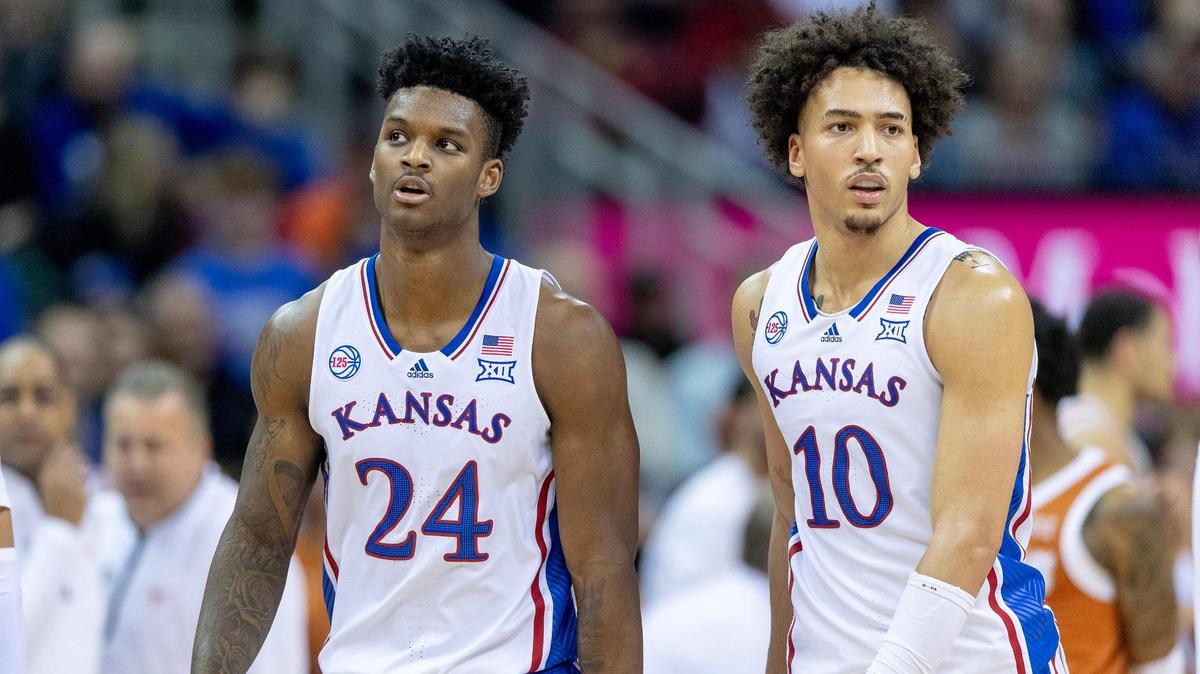 Kansas forwards K.J. Adams Jr. (24) and Jalen Wilson (10) react after a turnover against Texas during the Big 12 Tournament championship game Saturday, March 11, 2023, in Kansas City.