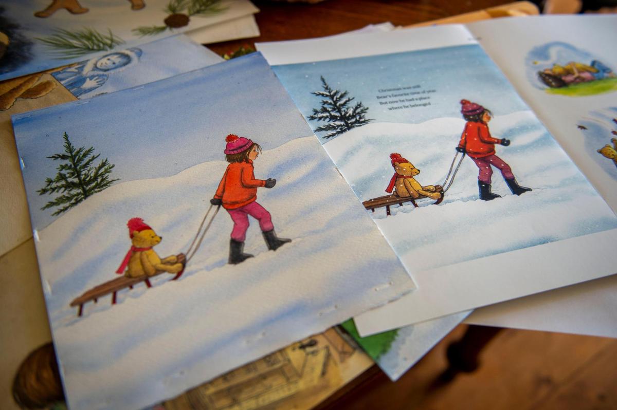Phyllis Harris displays the first drafts of illustrations for her new book, “The Gift Shop Bear,” at her home studio in Raymore. Harris says she builds her art piece by piece, sketching it first, then using watercolors to paint it and later scanning it to digitally add warmer tones.