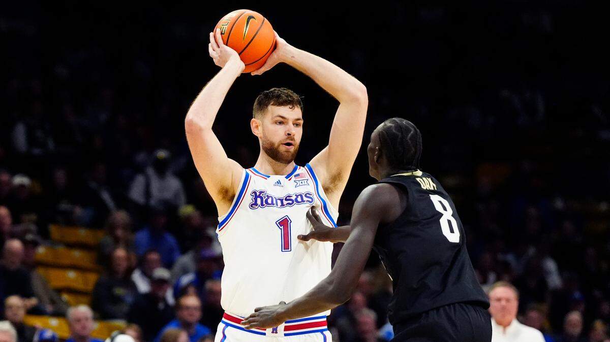 Colorado Buffaloes forward Bangot Dak (8) defends Kansas Jayhawks center Hunter Dickinson (1) in the first half at the CU Events Center on Feb. 24, 2025.