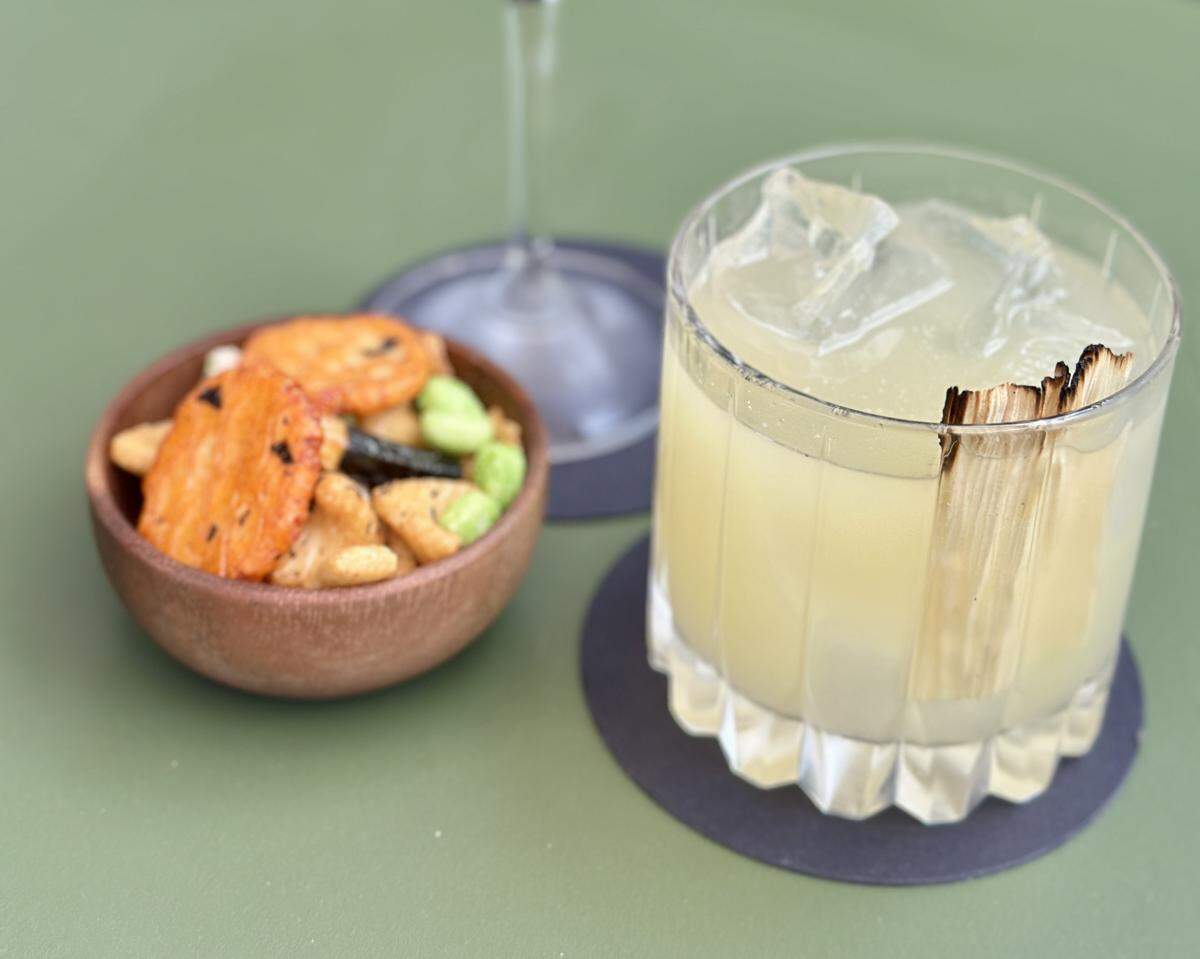 A cocktail and bar snacks at XO HiFi.