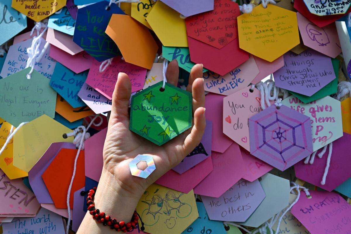 An art installation called “Intention Heart” by artist Eugenia Ortiz was meant to collect the positive intentions of people at the “No Kings” rally on Saturday, June 14, 2025, at Mill Creek Park in Kansas City.