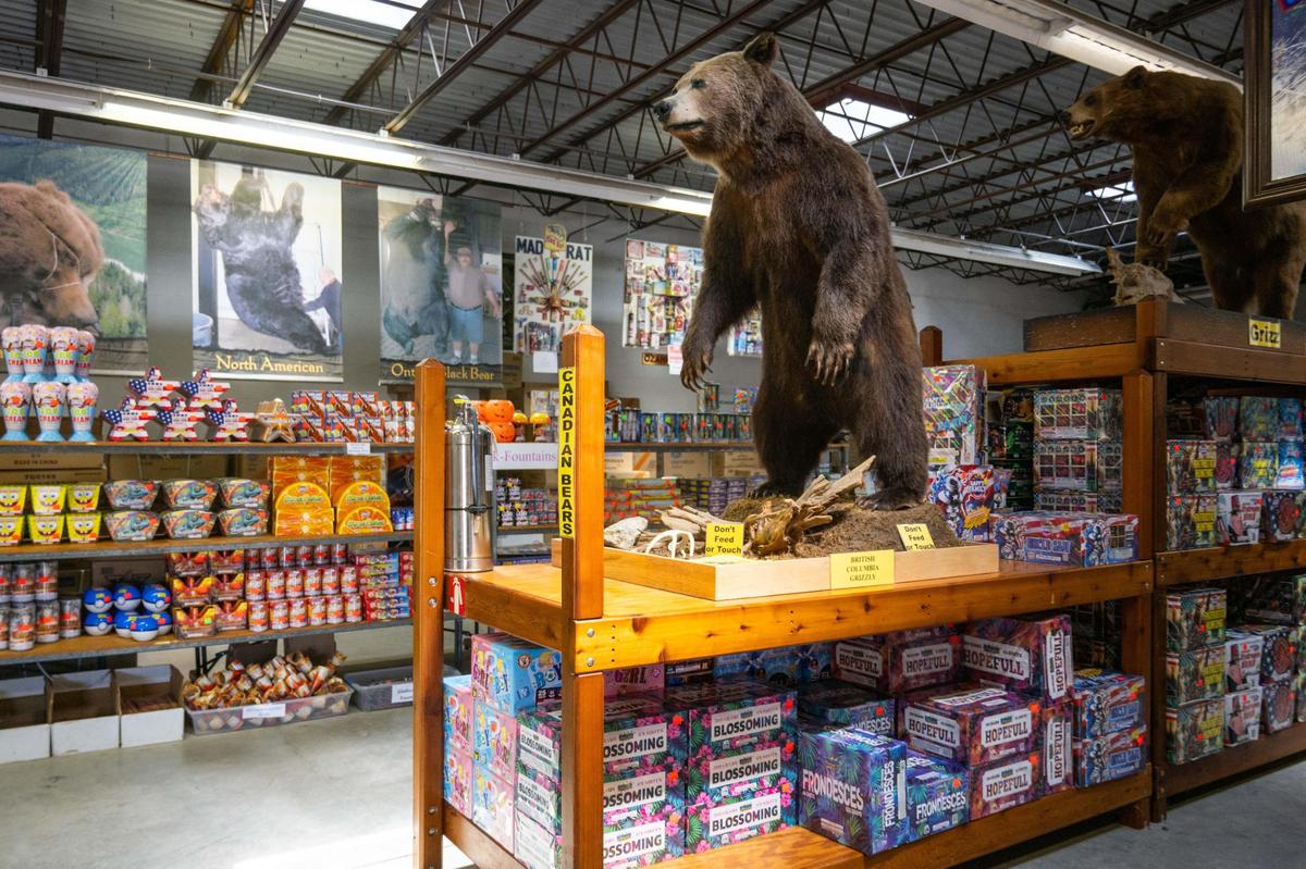 Bears stand amongst the fireworks at Mike’s Fireworks on the day before Independence Day in Riverside on Thursday, July 3, 2025. Mike’s Fireworks is a designated landmark fireworks shop.