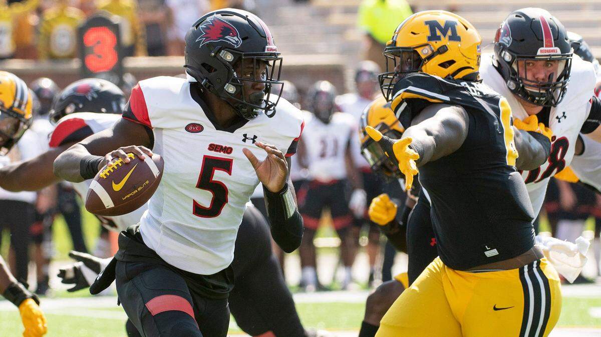 Missouri’s Darius Robinson, right, pressures Southeast Missouri State quarterback CJ Ogbonna on Saturday, Sept. 18, 2021, in Columbia.
