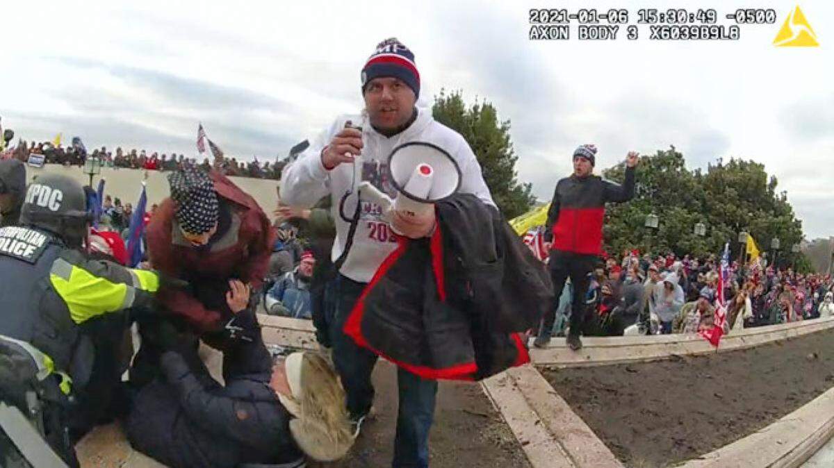 Federal authorities say this is Kyler Joseph Bard, center, of Seneca, Missouri, on Jan. 6 at the U.S. Capitol.