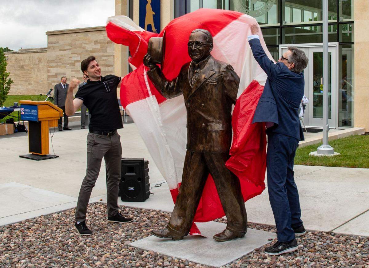 Clifton Truman Daniel, right, and his son Wesley unveiled a new statue of President Harry S. Truman this summer outside the Truman Library & Museum in Independence. Daniel is the president’s eldest grandson.
