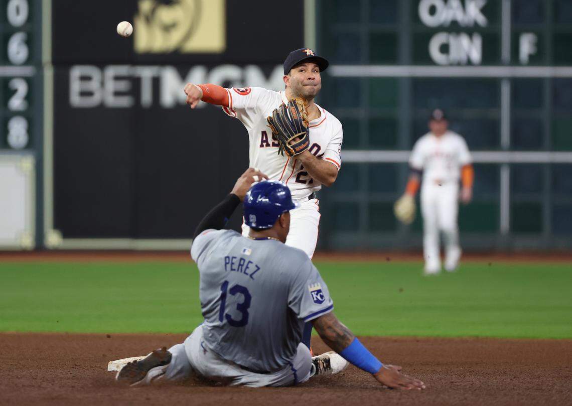 Houston Astros second baseman Jose Altuve (27) forces out Kansas City Royals catcher Salvador Perez (13) at second base in the seventh inning at Minute Maid Park on Aug 29, 2024 in Houston, Texas, USA.