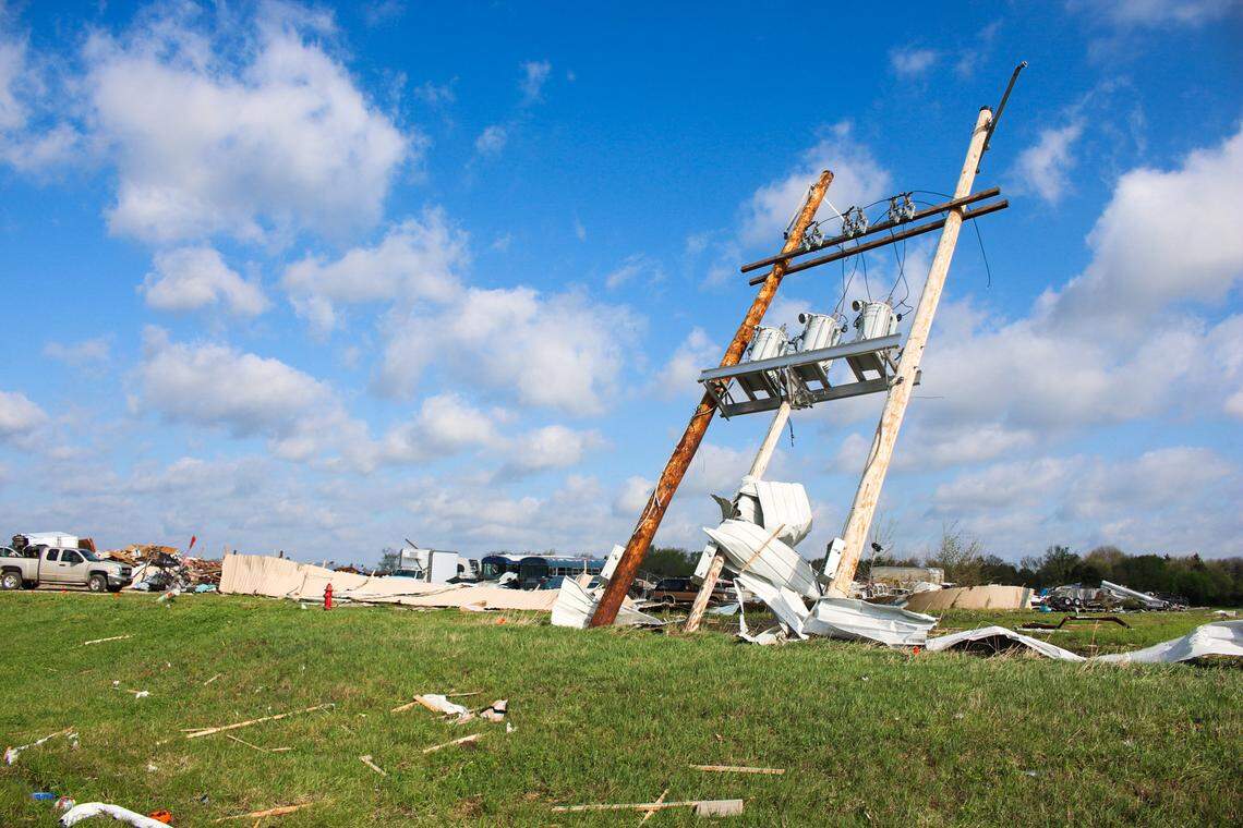 A power line pole is seen severely damaged and leaning backward near Hillsdale Boat & Mini Storage on April 14, 2026.