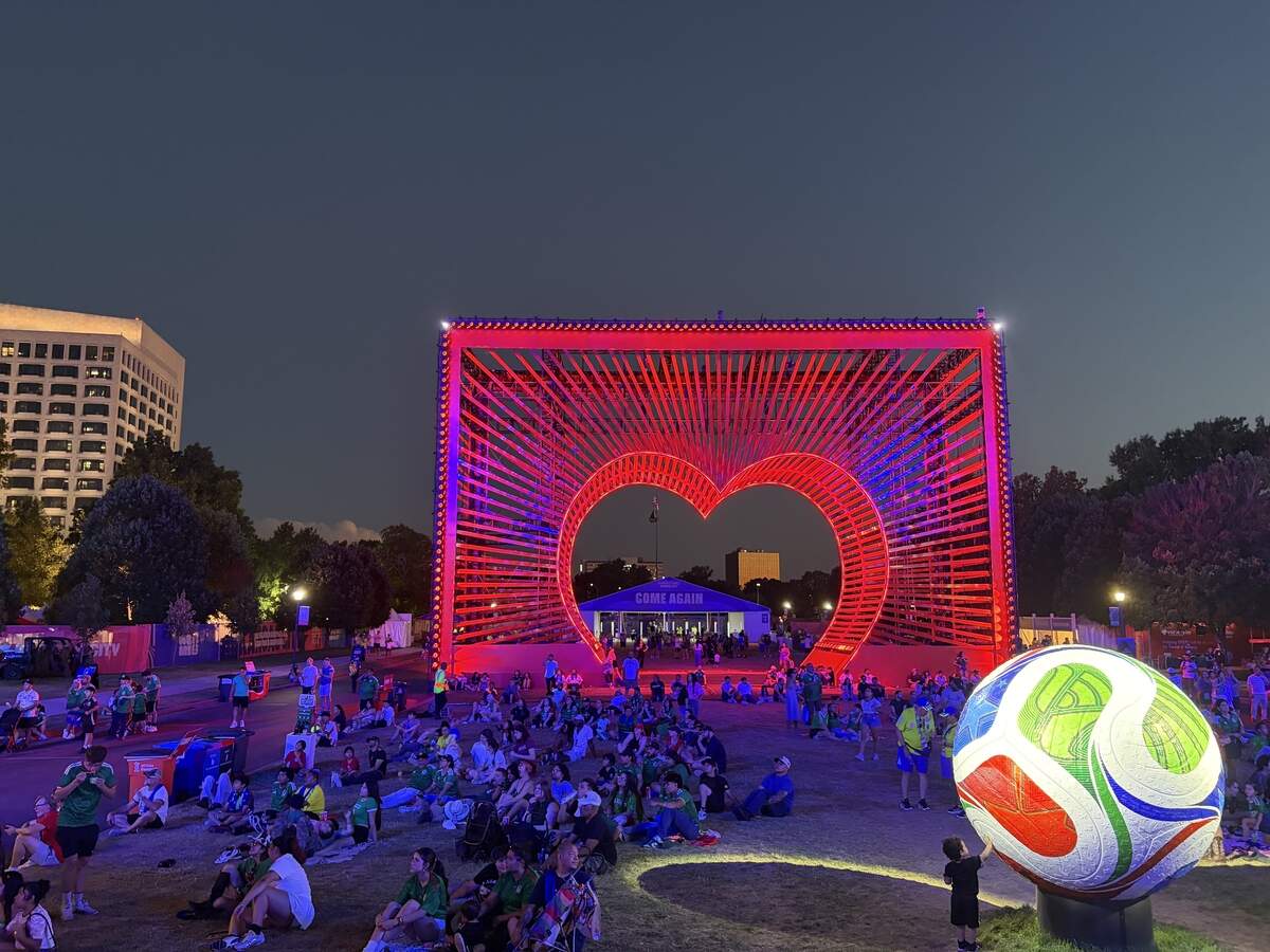 While thousands packed the stage area of the FIFA Fan Fest Sunday, July 5, to watch Mexico’s round of 16 match against England, hundreds found space to sit down away from the crowds near the heart structure. TV screens were located above so they could watch the game.