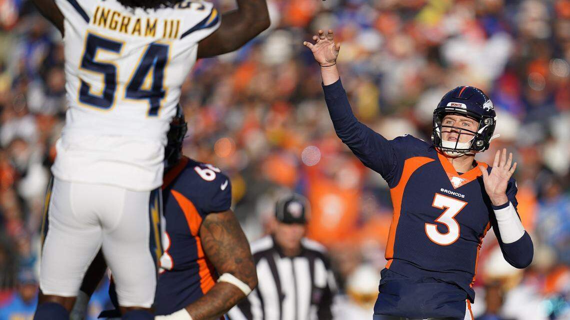 Broncos quarterback Drew Lock passes under pressure form Los Angeles Chargers defensive end Melvin Ingram Sunday in Denver.