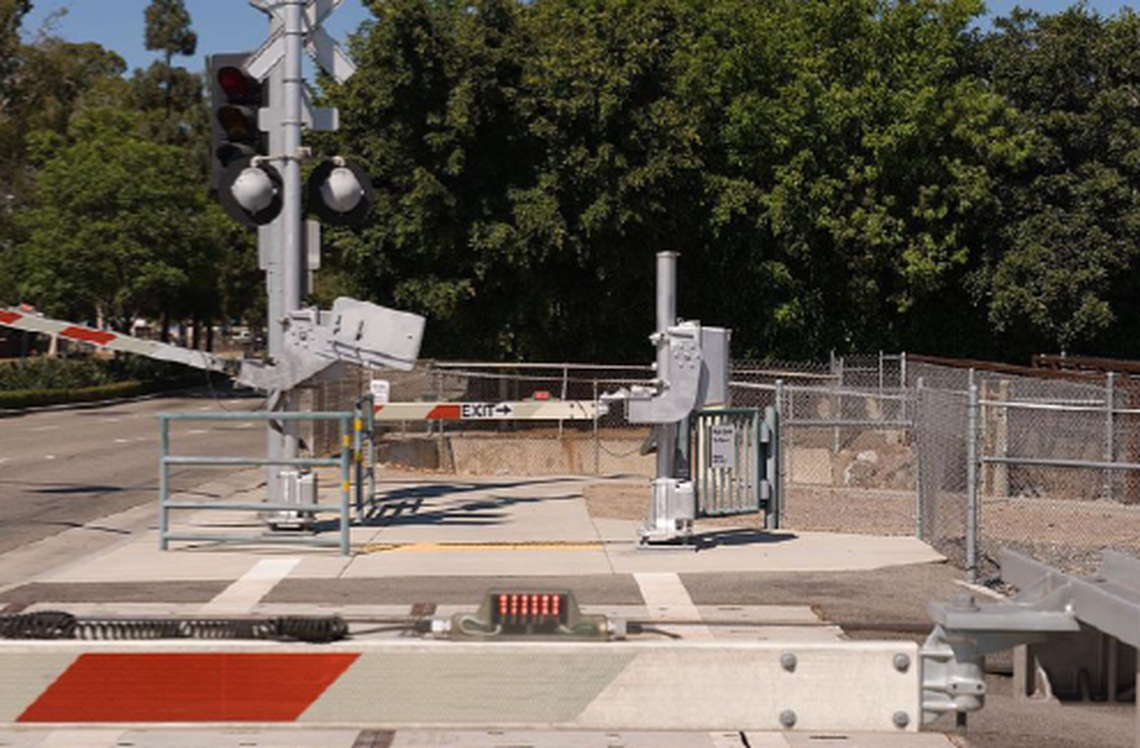 An automatic pedestrian gate located at a crossing.