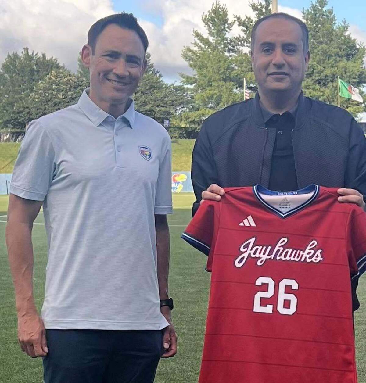 Kansas Jayhawks soccer coach Nate Lie with Algerian soccer president Walid Sadi.
