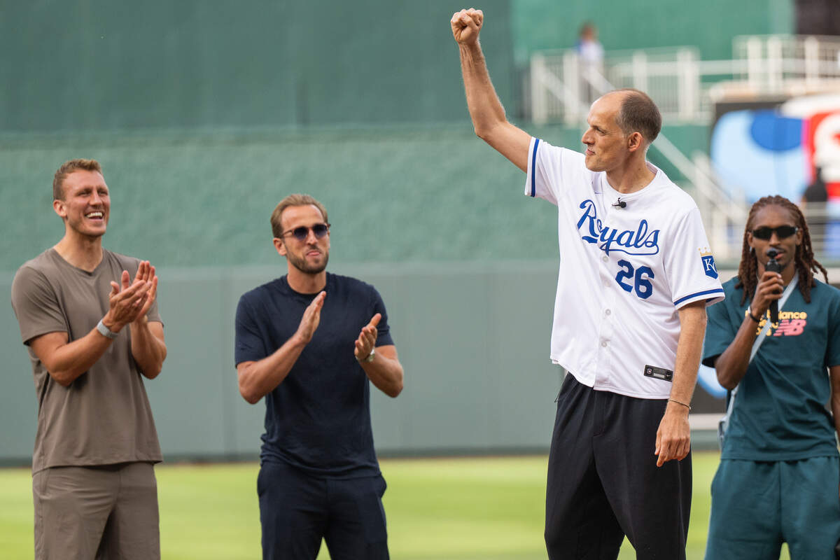 England national soccer team manager Thomas Tuchel raises his fist after throwing out the first pitch before the Royals game vs. the St. Louis Cardinals, at Kauffman Stadium on Thursday, June 18, 2026.