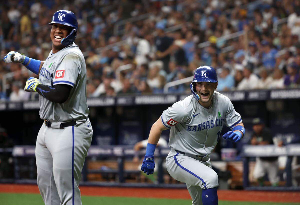 Kansas City Royals second base Michael Massey (19) is congratulated by Kansas City Royals catcher Salvador Perez (13) after he hit a three-run home run against the Tampa Bay Rays during the fifth inning at Tropicana Field on May 24, 2024 in St. Petersburg, Florida, USA.