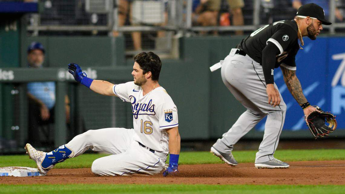 The Royals’ Andrew Benintendi (left) slides safely into at third on a triple ahead of the throw to Chicago White Sox third baseman Yoan Moncada during the second inning Friday, Sept. 3, 2021, at Kauffman Stadium in Kansas City, Mo.