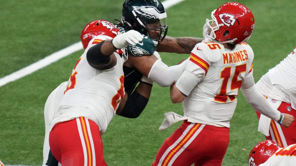 Feb 9, 2025; New Orleans, LA, USA; Kansas City Chiefs quarterback Patrick Mahomes (15) is sacked by Philadelphia Eagles defensive tackle Jalen Carter (98) and defensive tackle Milton Williams (93) during the fourth quarter in Super Bowl LIX at Caesars Superdome. Mandatory Credit: Kirby Lee-Imagn Images