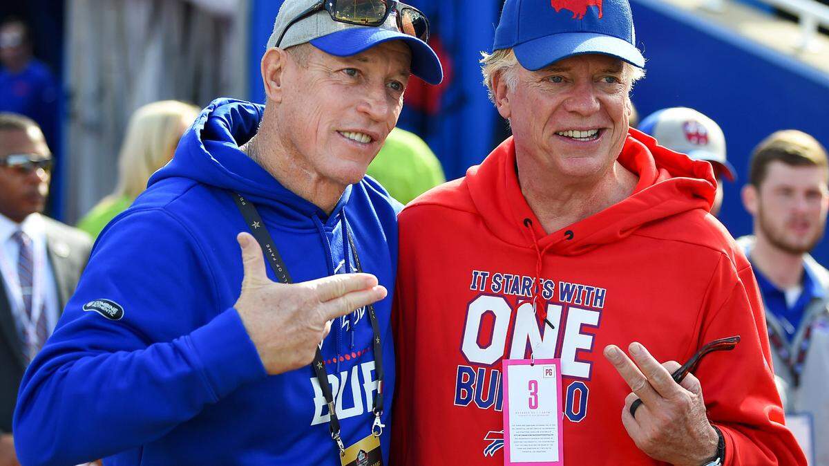 NFL Bills quarterback Jim Kelly (left) poses for a photo with actor Christopher McDonald (right) prior to the game between the Miami Dolphins and Buffalo.