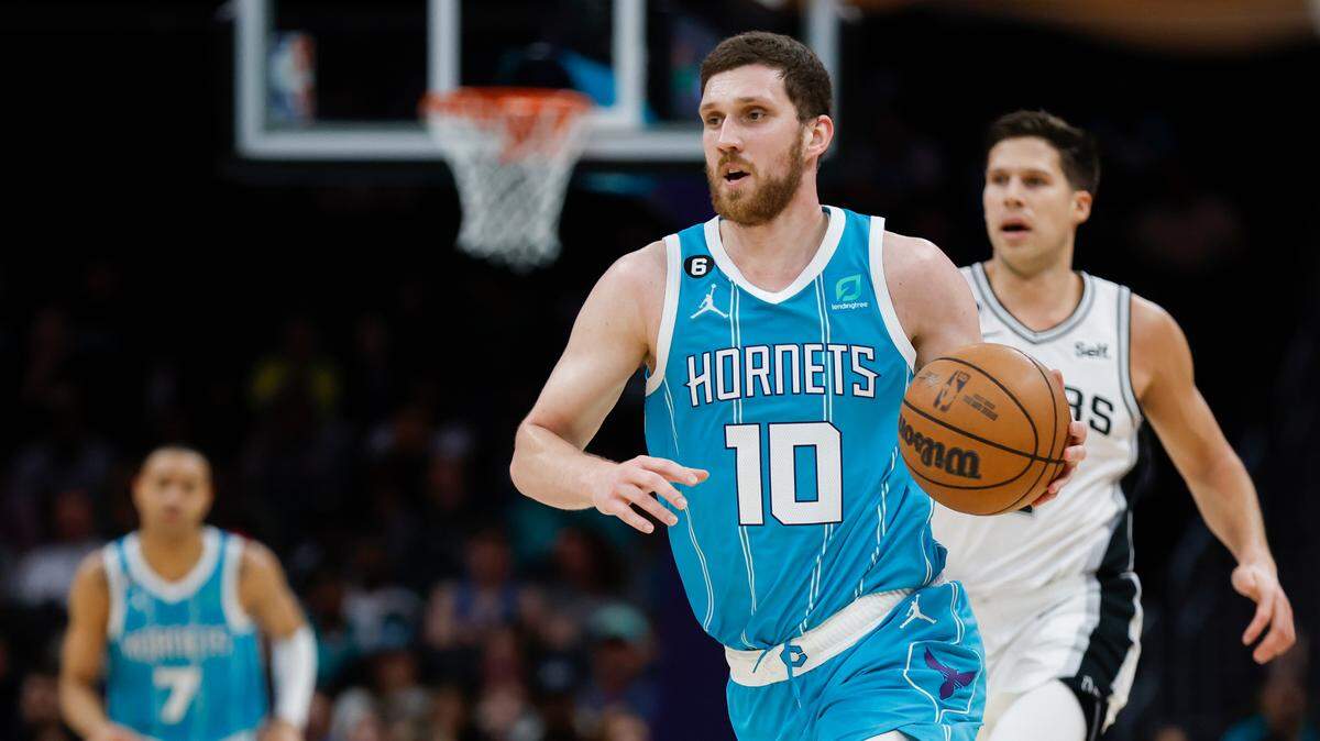 Charlotte Hornets guard Svi Mykhailiuk (10) pushes the ball up against the San Antonio Spurs during the second half at Spectrum Center in Charlotte, North Carolina on Feb. 15, 2023.
