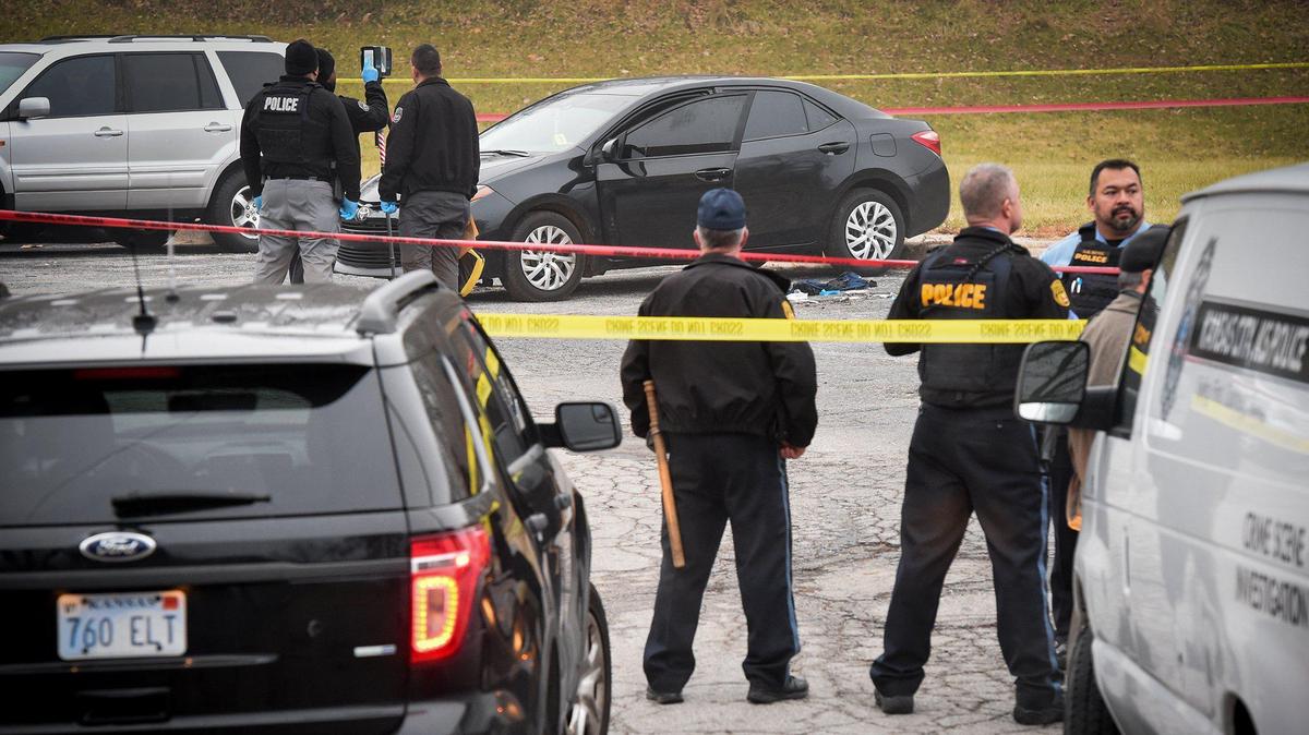 Kansas City, Kansas, police investigate a shooting. The Kansas State Rifle Association is pushing back on cities that have issued proclamations recognizing Gun Violence Awareness Month.