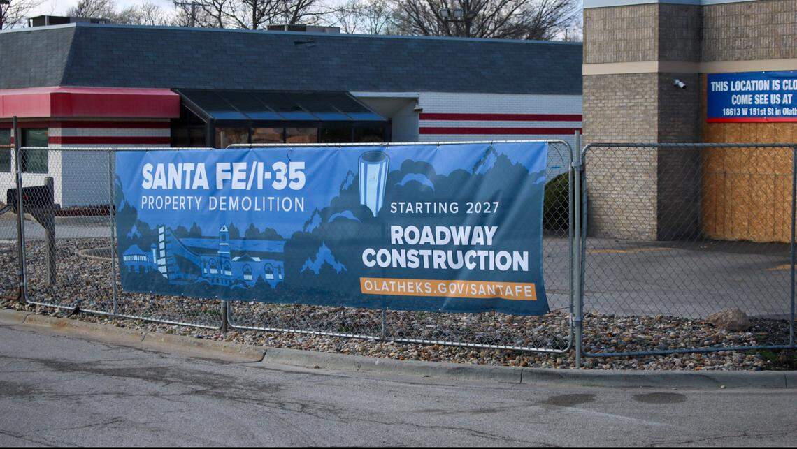 A sign is seen attached to a fence along former businesses near Santa Fe Street where demolitions are taking place. Roadwork is anticipated to begin on Santa Fe starting next year.