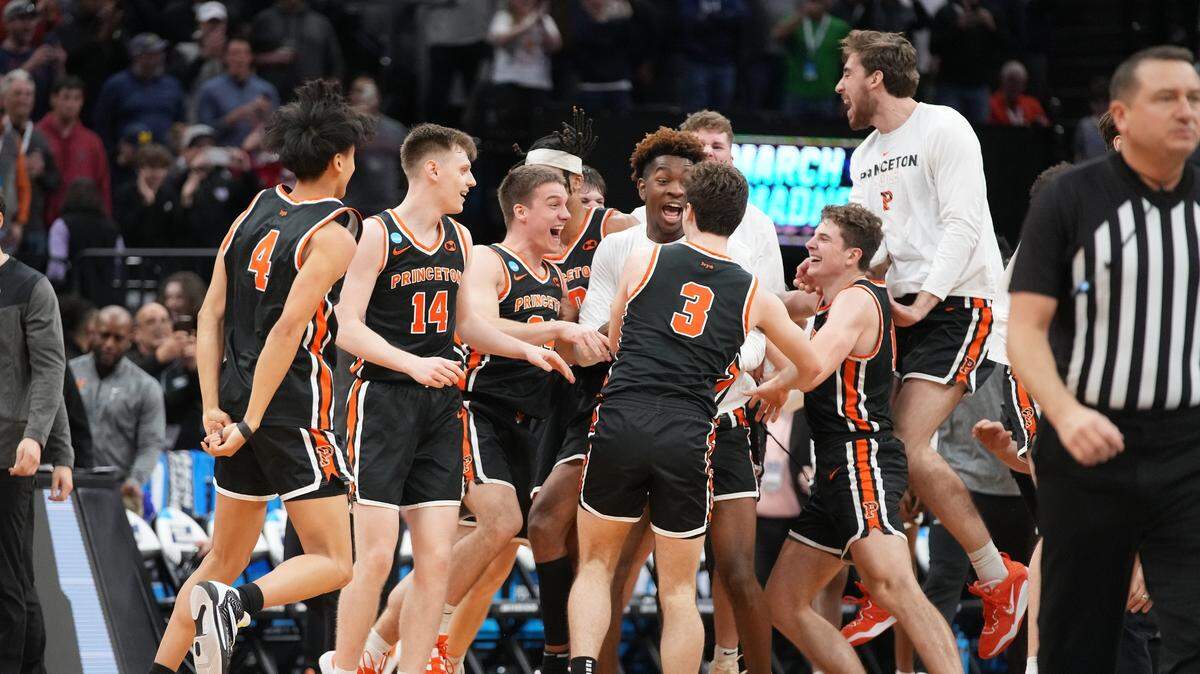 Princeton Tigers celebrate the victory against the Arizona Wildcats at Golden 1 Center on March 16, 2023.