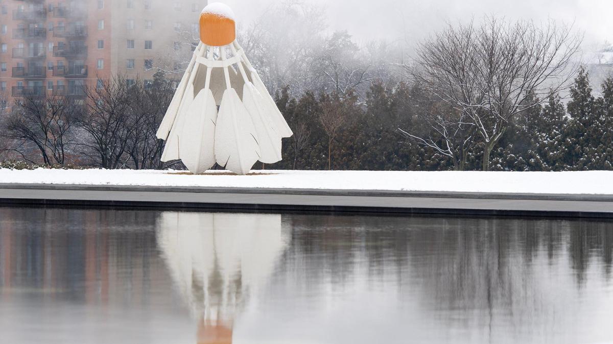 A shuttlecock is covered in snow on the grounds of the Nelson-Atkins Museum of Art on Wednesday, Jan. 25, 2023, in Kansas City.