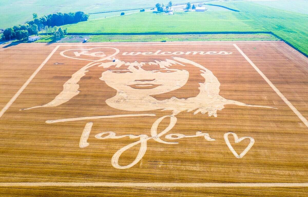 Cutting a swath through the wheat stubble, Rob Stouffer of Precision Mazes, worked Monday, July 3, 2023, creating a mammoth welcome message to Taylor Swift in a field in Orrick, Missouri, in Ray County. It took Stouffer about 13 hours to create the crop art.