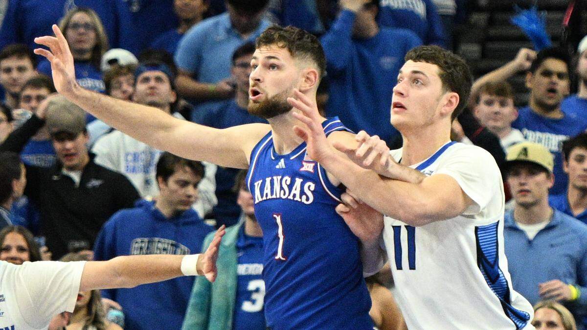 Kansas Jayhawks center Hunter Dickinson (1) reaches for a ball against Creighton Bluejays center Ryan Kalkbrenner (11) during the second half at CHI Health Center Omaha on Dec. 4, 2024.