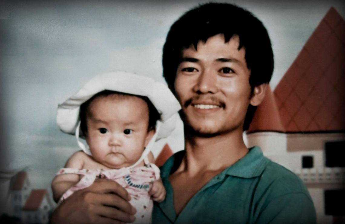 Xiaolin Ji and his daughter, Mengqi Ji, when she was a toddler, in a photo from a family album.