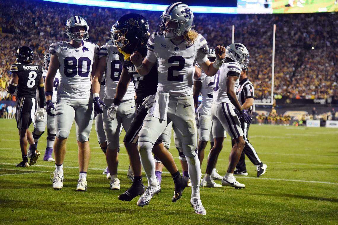 Kansas State Wildcats quarterback Avery Johnson (No. 2) celebrates his first-half touchdown with a Neon Deion/Coach Prime-style dance during Saturday night’s Big 12 football game against the Deion Sanders-coached Colorado Buffaloes at Folsom Field in Boulder, Colo.
