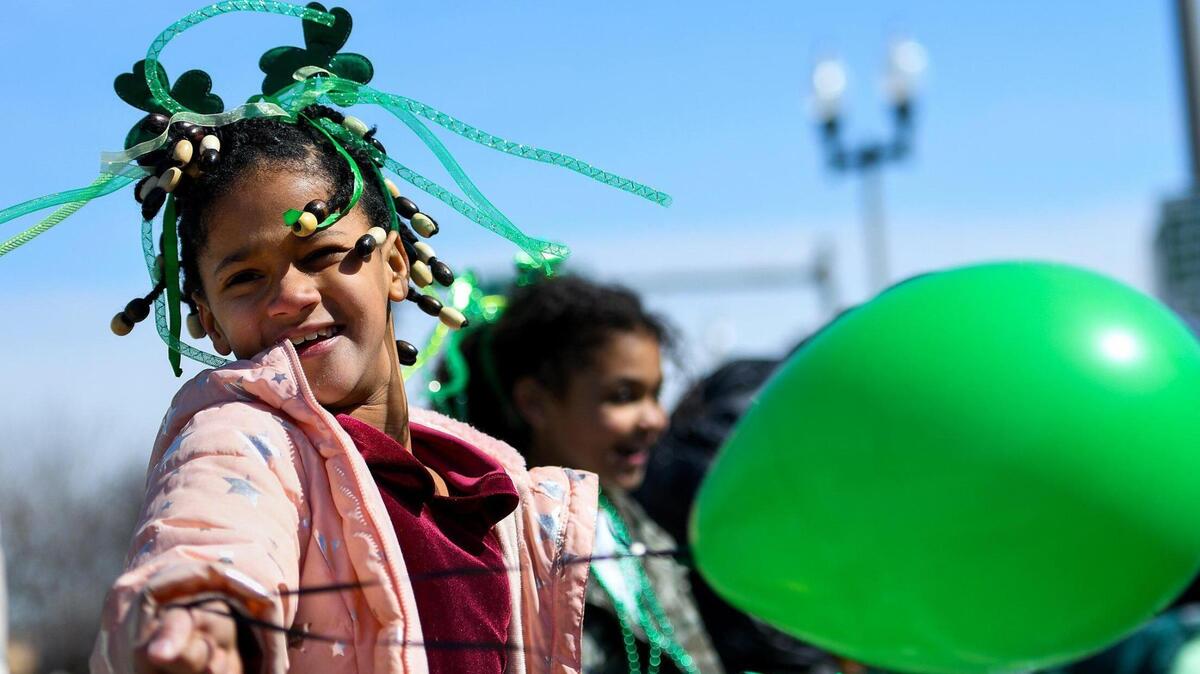 Eight-year-old Lilly Venuto of Kansas City twirled with a balloon she got at Saturday’s Snake Saturday Parade in North Kansas City.