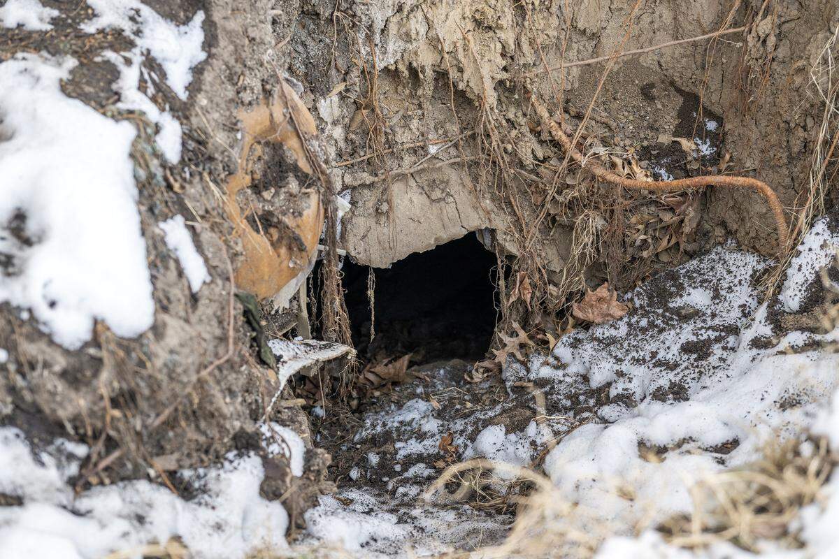 Debris is seen inside a sinkhole in the backyard of Cassandra Krul's home on Monday, Feb. 2, 2026, in Independence.