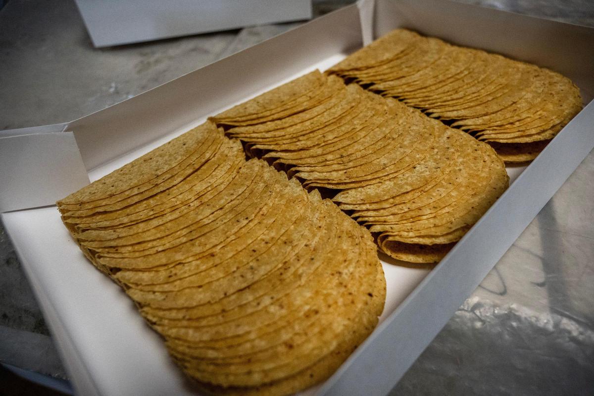 Taco shells are stored in boxes awaiting export at Perez Food Products on Thursday in Kansas City.