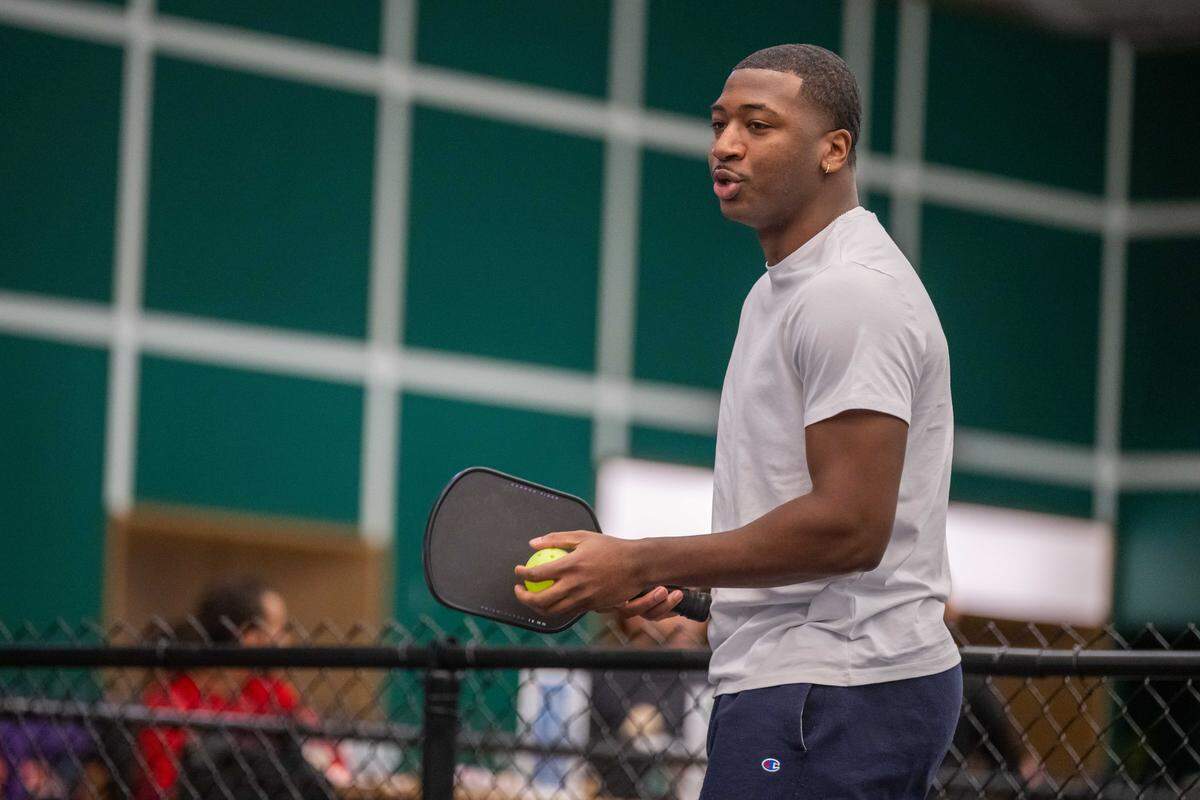 Brandan Jackson, founder of the Black Pickleball Club, prepares to serve during a match at SW19 at the Stadium, on Sunday, Feb. 22, in Kansas City.