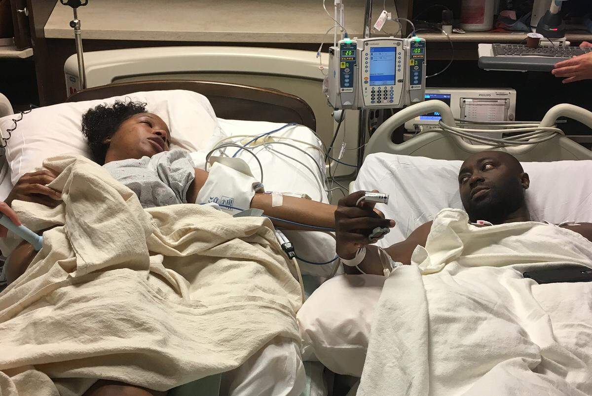 In this photo taken by a nurse on Oct. 8, 2016, Julie McBride (left) and her husband, Jevon McBride, lay injured while being prepped for surgery at St. Luke's Hospital after being involved in a head-on collision near their home in Warrensburg, Missouri. 