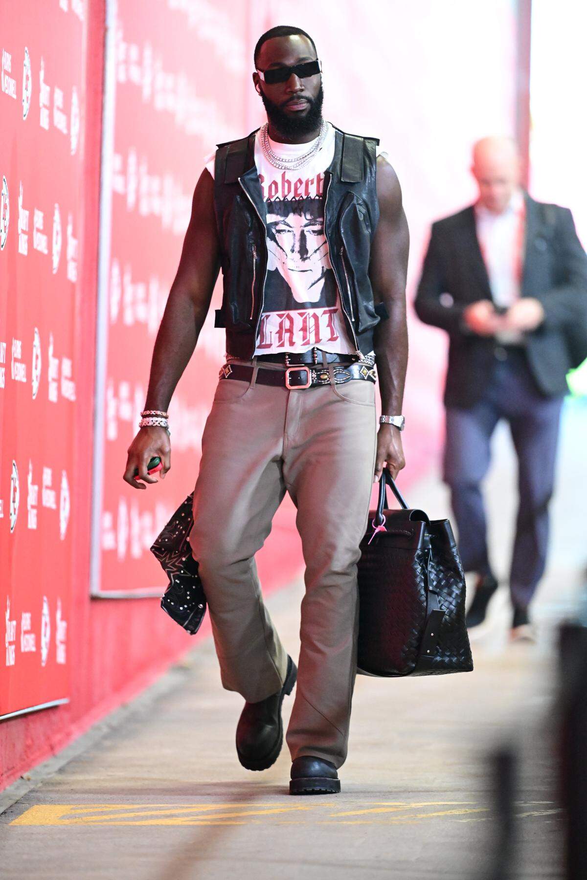 Charles Omenihu wore a Robert Plant T-shirt.
