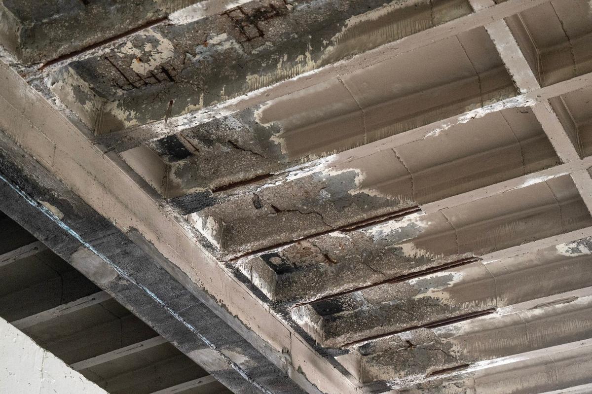 Cracked concrete and exposed rebar at a parking garage on the Country Club Plaza. The district’s new owners, HP Village Partners, plan to replace three garages.