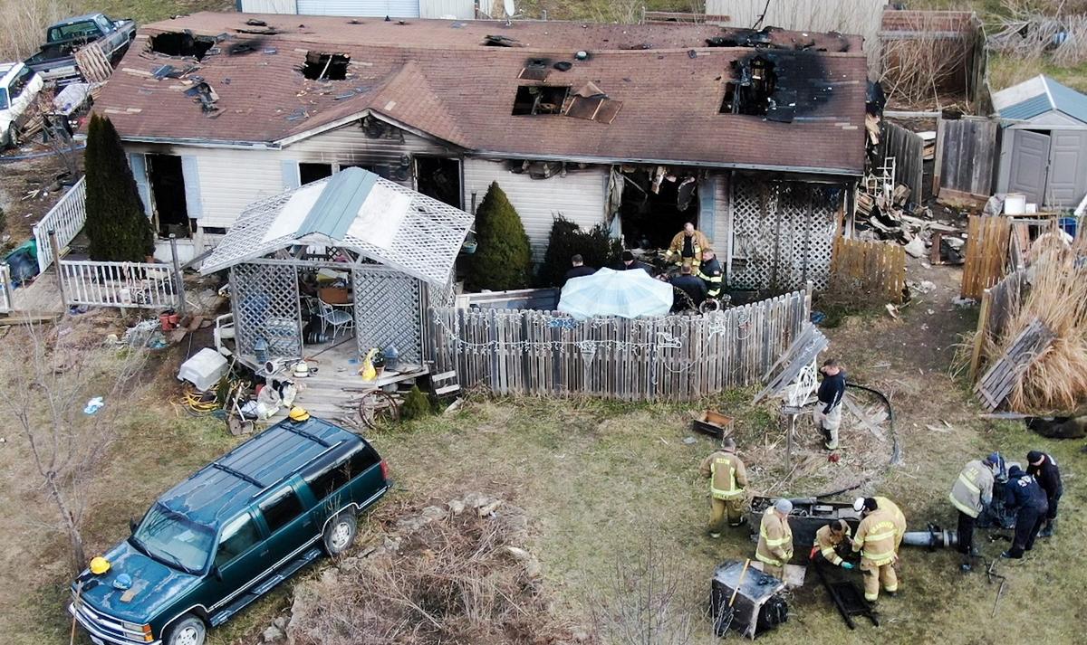 Fire investigators were on the scene in the 23300 block of Deer Run Road in Peculiar, Missouri on Monday looking for the cause of a house fire after a West Peculiar firefighter was killed Sunday after falling through the floor while battling the house fire.
