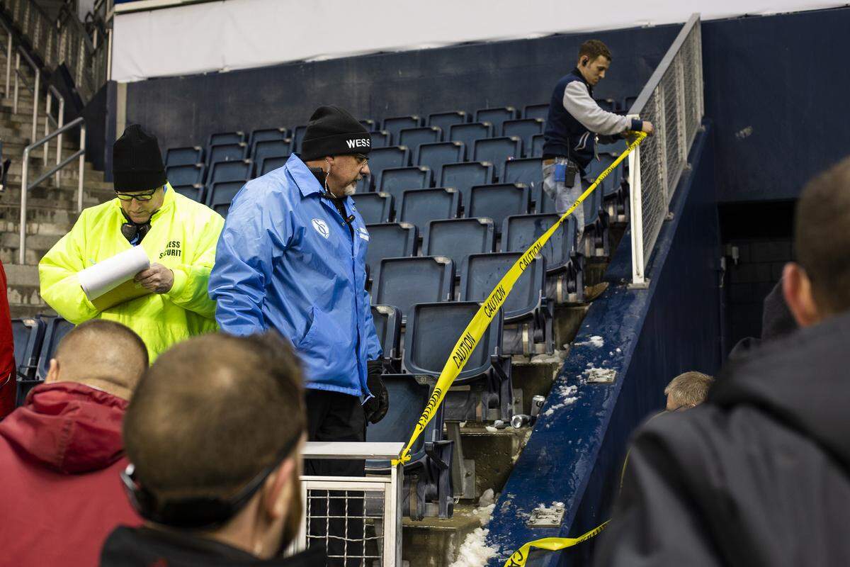 Wess Security inspect the railing failure near the visitor’s tunnel and put up caution tape after Thrusday night’s Sporting Kansas City match against Toluca at Children’s Mercy Park. At least one Toluca supporter received medical attention on the field after the incident.