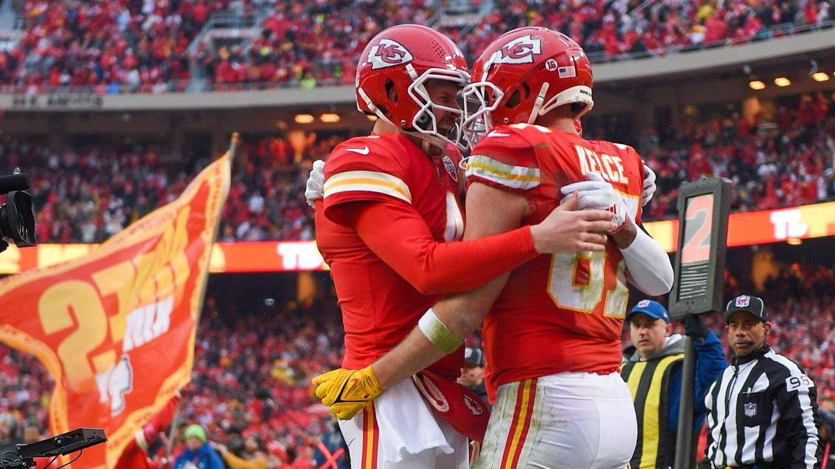 Kansas City Chiefs quarterback Chad Henne, left, celebrates with tight end Travis Kelce after Kelce scored with a pass reception in the second quarter against the Jacksonville Jaguars during the Divisional Round game Saturday, Jan. 21, 2023 at GEHA Field at Arrowhead Stadium.